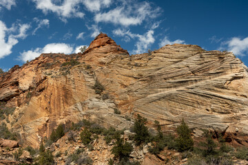Fototapeta premium Scraping Texture Covers Wall Beneath Blue Sky In Zion