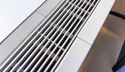air vent system, silver grilles on white wall, essential for fresh indoor air, HVAC technology concept