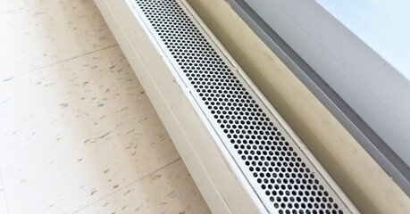 air vent system, silver grilles on white wall, essential for fresh indoor air, HVAC technology...