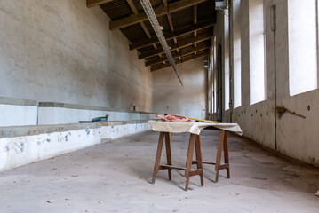 A table in an empty derelict hall
