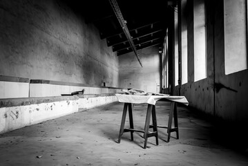 A table in an empty derelict hall