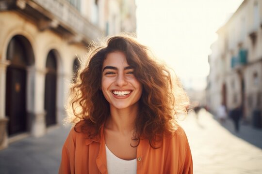 Fototapeta Italian girl with a beautiful smile on the street in summer