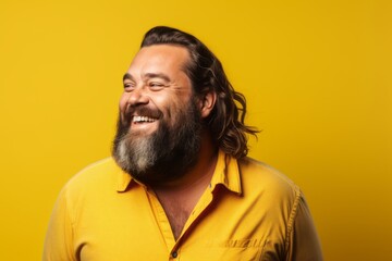 Portrait of a funny man with long beard and mustache on yellow background