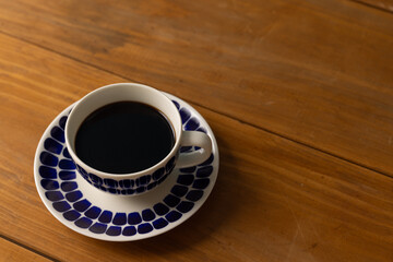 Cup of hot coffee on a table,