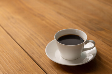 Cup of hot coffee on a table,