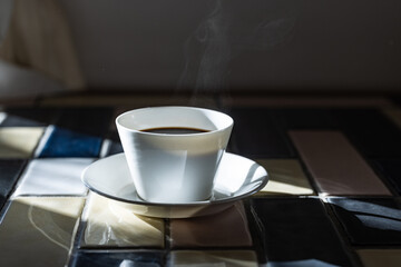 Cup of hot coffee on a table,