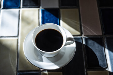 Cup of hot coffee on a table,