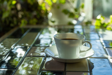 Cup of hot coffee on a table,