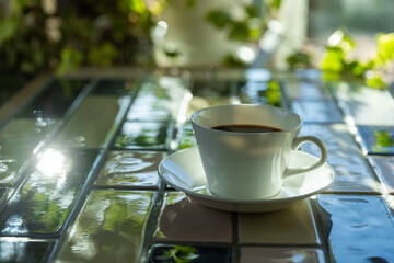 Cup of hot coffee on a table,