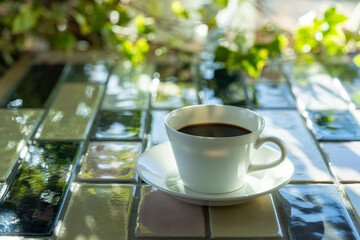Cup of hot coffee on a table,