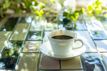 Cup of hot coffee on a table,