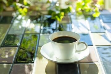 Cup of hot coffee on a table,