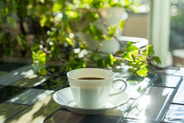 Cup of hot coffee on a table,