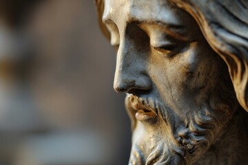 Macro of Jesus Christ's serene expression in a statue, embodying peace and spirituality.