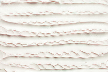 Top view of pink buttercream for decorating cake, silky smooth american buttercream on a marble surface, overhead view of smooth buttercream