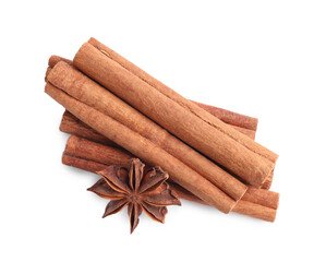 Aromatic cinnamon sticks and anise stars isolated on white, top view