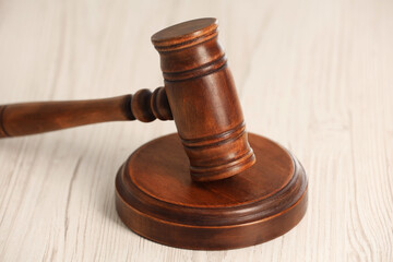 Law concept. Gavel on white wooden table, closeup