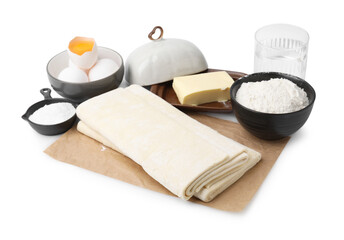 Raw puff pastry dough and ingredients isolated on white