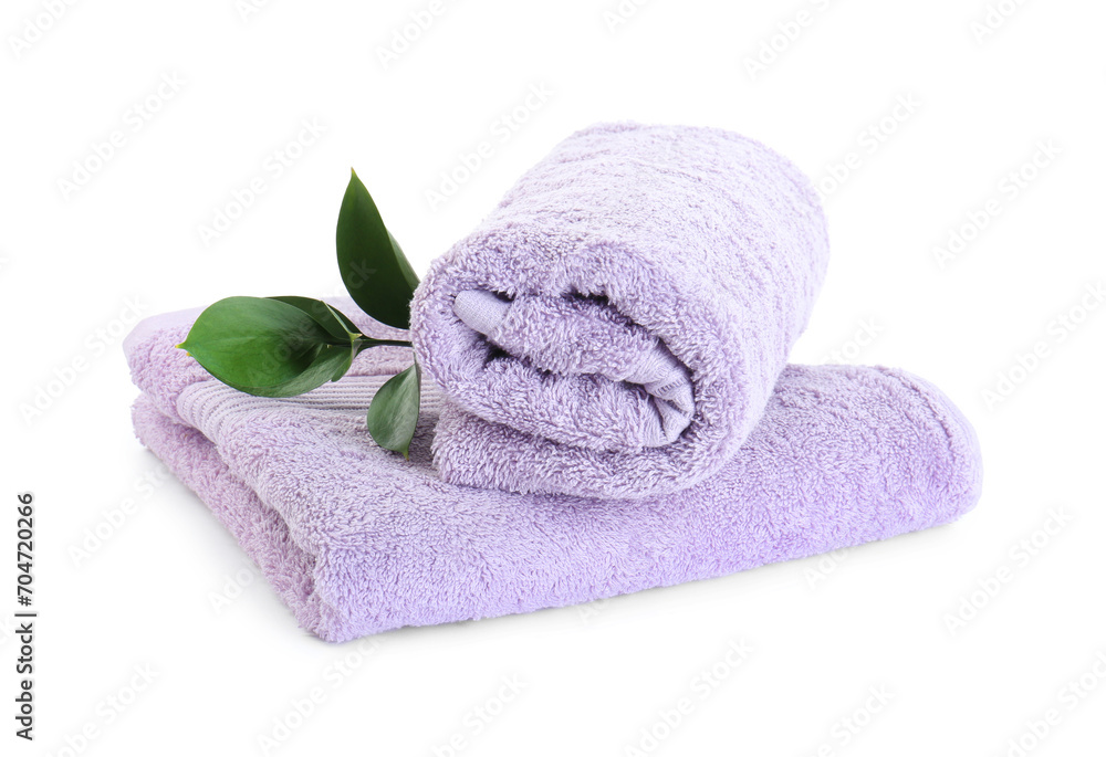 Sticker Violet terry towels and green leaves isolated on white