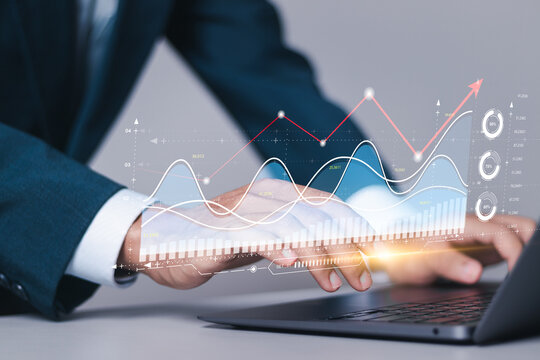 Investment strategy planning. Businessman use computer laptop with analyzes financial growth graph for long-term investment, Financial goals and global economic business planning.