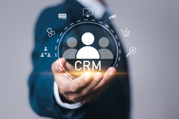 Businessman with virtual customer network management and development of customer information exchange, social media, digital online. CRM Customer Relationship Management concept.