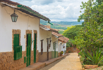 Barichara, Santander, Colombia. Historic village with old buildings, cobblestone streets, and sky. Colonial houses and streets