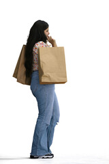 A woman, on a white background, with a package, profile