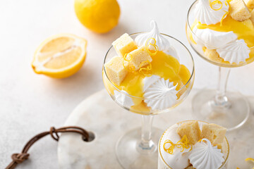 Lemon trifle with pound cake, lemon curd and meringue in coupe glasses