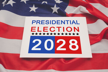 Presidential election 2028 text on white paper over the American flag background.