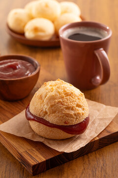 Brazilian snack. P&atilde;o de Queijo filled with guava cream (Goiabada). Breakfast. Black coffee.