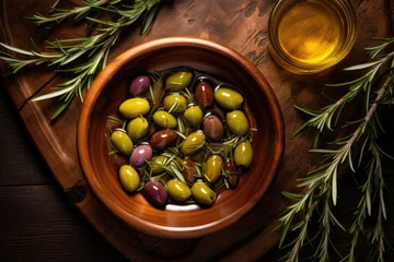 Foto op Plexiglas Top view of olives oil and rosemary leaves in wooden bowl © The Big L