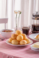 Boho Breakfast table. Typical Brazilian breakfast. Pão de Queijo. Black Coffee. Butter toast. Granola.