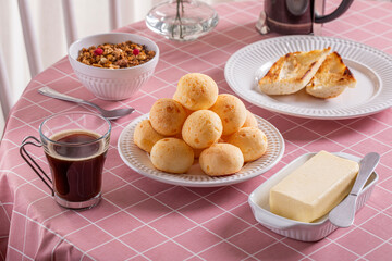 Boho Breakfast table. Typical Brazilian breakfast. Pão de Queijo. Black Coffee. Butter toast. Granola.