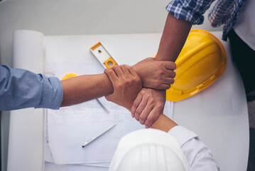 Group of multiracial people Teamwork meeting join hands Engineer Manager Foreman fist bump together. Close up diversity engineer people hands partner teams. Business connection team join partnership