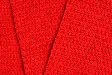 overlap of red wool knitted yarn texture, woolen fabric background