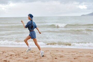 Sunrise Fitness: A Beautiful Female Jogger Running on the Beach at Sunrise, Surrounded by the Serene Sea