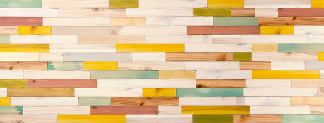 カラフルにペイントされた木材による寄せ木細工の背景テクスチャー