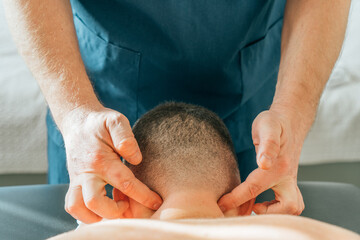 Patient with neck pain getting acupressure massage from doctor therapist masseur, close up. Chinese...