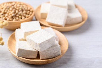 Fresh tofu in wooden bowl, Vegan food ingredient in Asian cuisine, Plant based diet
