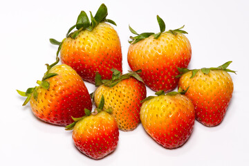 Many strawberries on a white background
