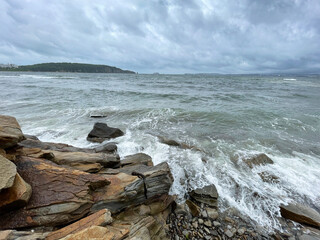 Vladivostok, waves in the Ussuri Bay near Patroclus Bay in cloudy summer weather