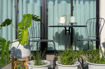 Terrace with metal table and chairs in the garden at home
- 704763039