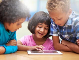Fototapeta premium Students, kids learning and tablet in classroom for online education, video streaming and information in group. Happy children with digital technology and scroll for knowledge and school development