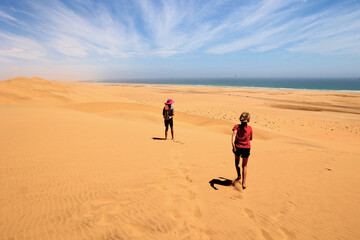 Two children play in Swakopmund dunes