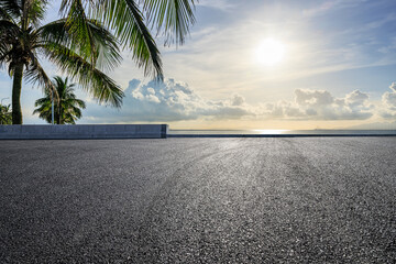 Asphalt road and coastline with sky clouds in the morning
