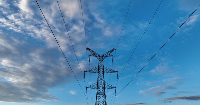 high voltage tower in cloud sky