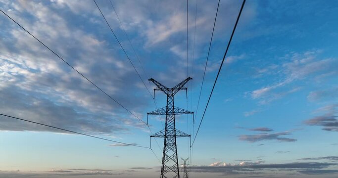 high voltage tower in cloud sky