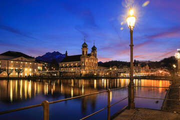 Splendid sunset over the  Jesuit church with Pilatus mountain at background in the evening and...