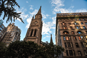 The Tower of Marble Collegiate Church among the Buildings of Manhattan, New York City - obrazy, fototapety, plakaty