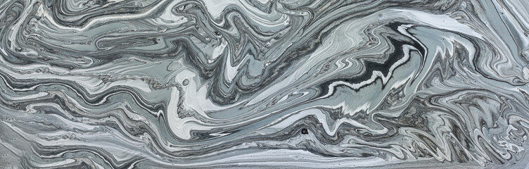 art photography of abstract marbleized effect background with black, gray and white creative colors. Beautiful paint.